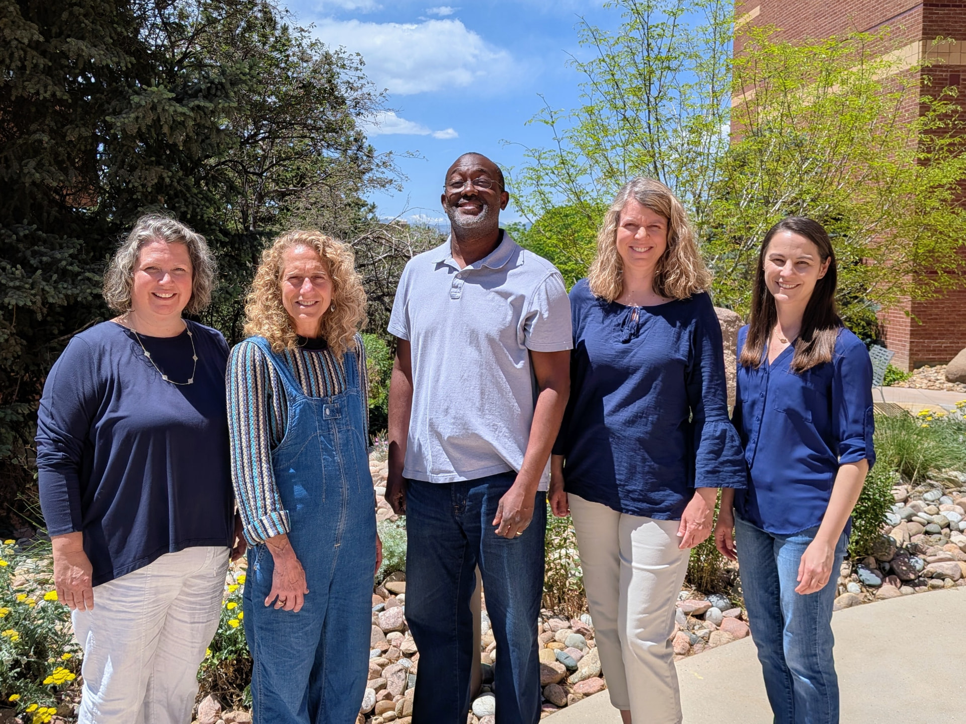The Arapahoe Park Pediatrics provider team standing together outside the Littleton office